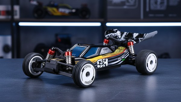 Buggy RC Velocity-24 présentation carrosserie racing flammes aileron amortisseurs rouges détails